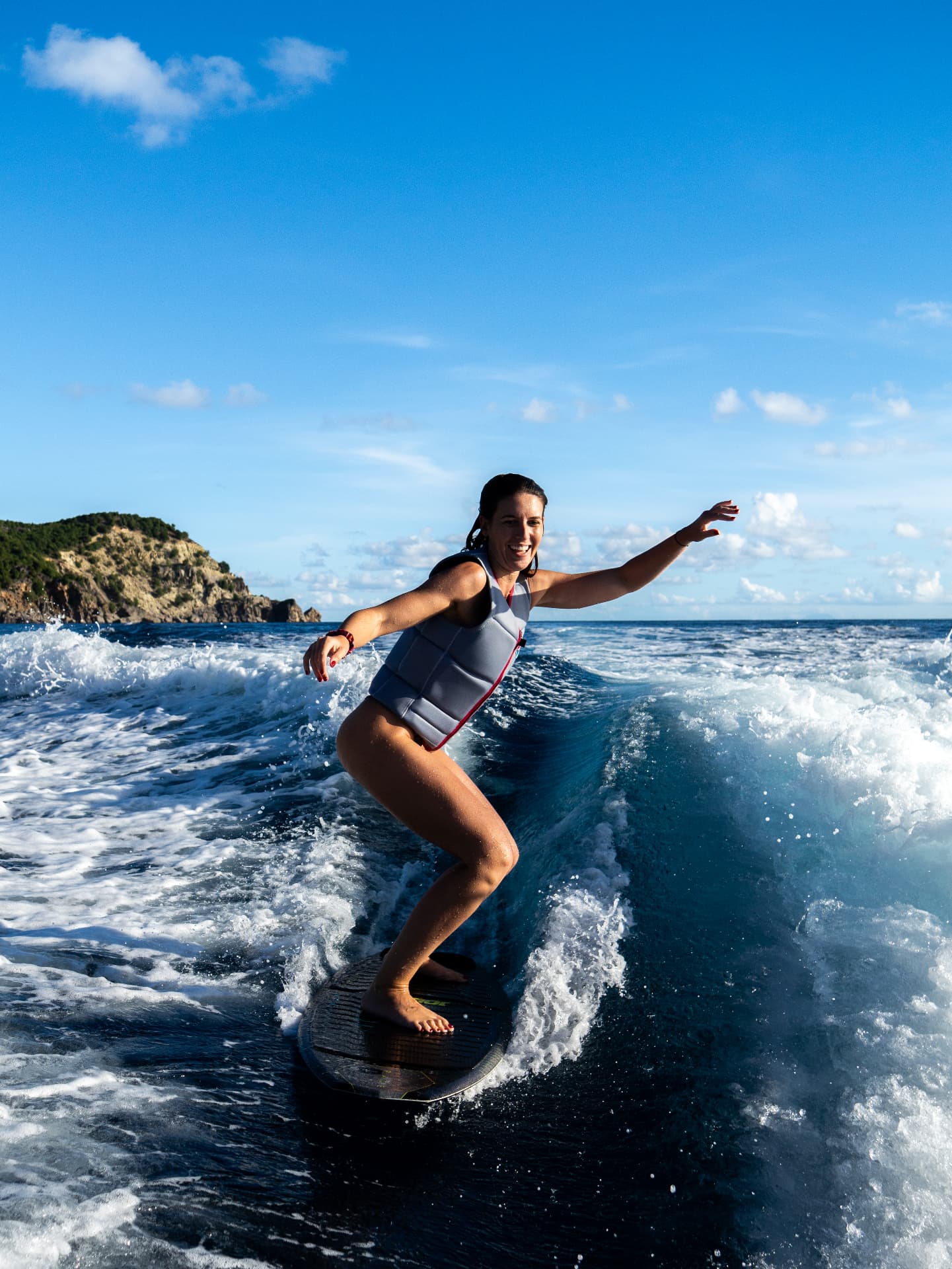 Woman wakesurfing behind the boat in Saint-Barthélemy